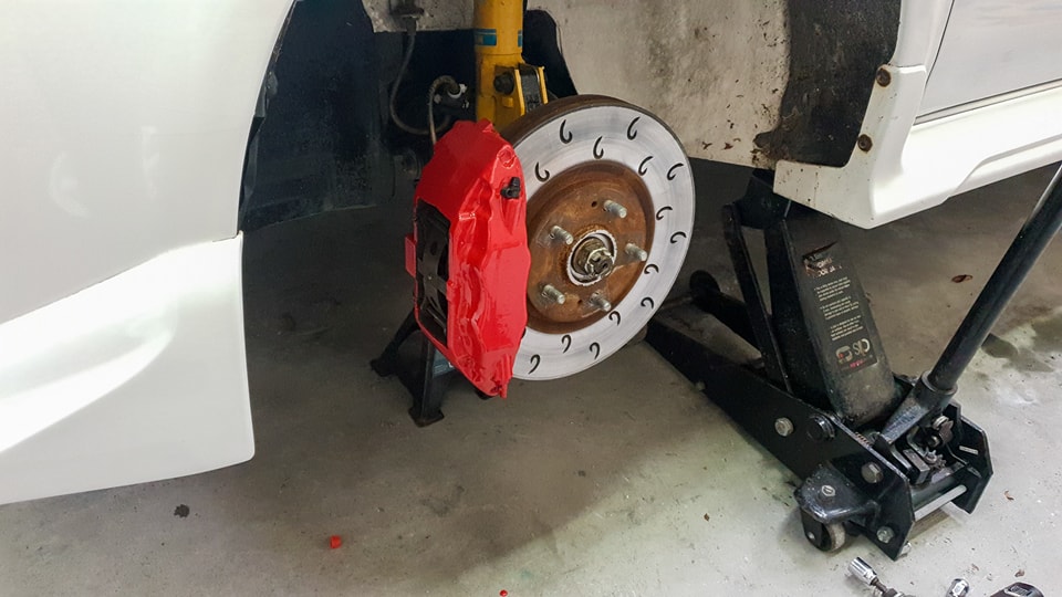 Close-up of freshly painted brake calipers